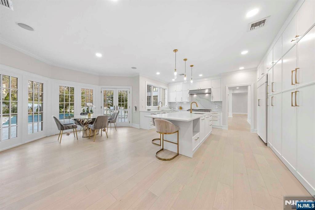 5 Ellen's Way Alpine, NJ 07620 - Photo 19 of 49 a living room with furniture and a dining table with kitchen view