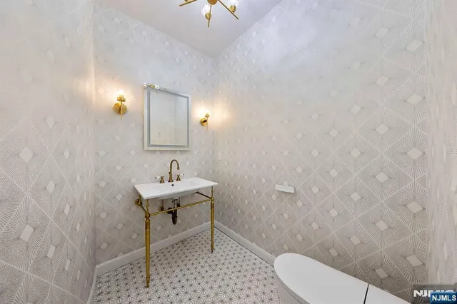 a view of a bathroom from a corridor