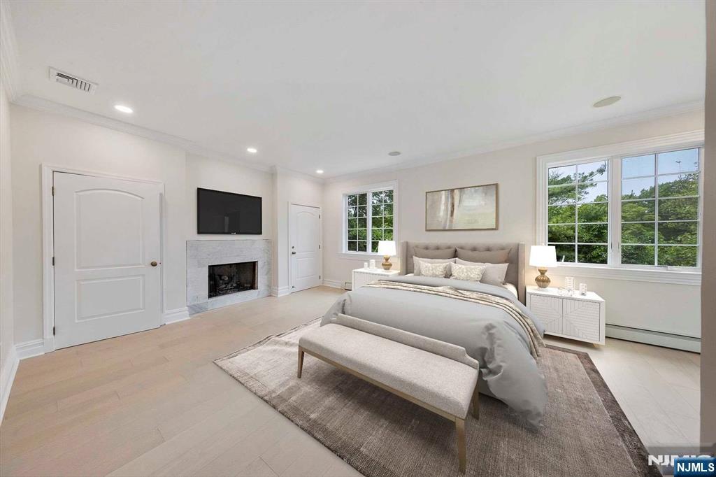 5 Ellen's Way Alpine, NJ 07620 - Photo 26 of 49 a spacious bedroom with a large bed and a flat screen tv