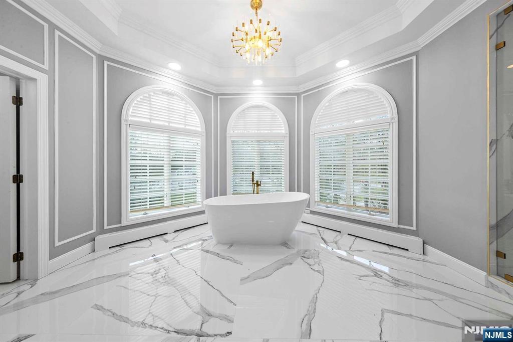 5 Ellen's Way Alpine, NJ 07620 - Photo 32 of 49 a living room with a large window and chandelier