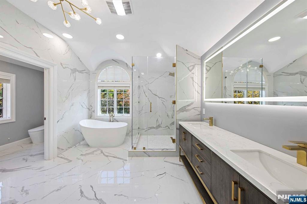 5 Ellen's Way Alpine, NJ 07620 - Photo 40 of 49 a bathroom with a double vanity sink a toilet a mirror and shower