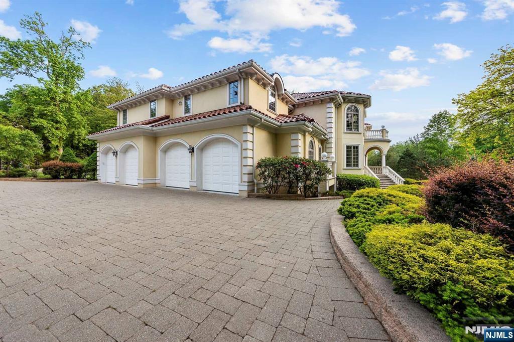 5 Ellen's Way Alpine, NJ 07620 - Photo 8 of 49 a front view of a house with a garden