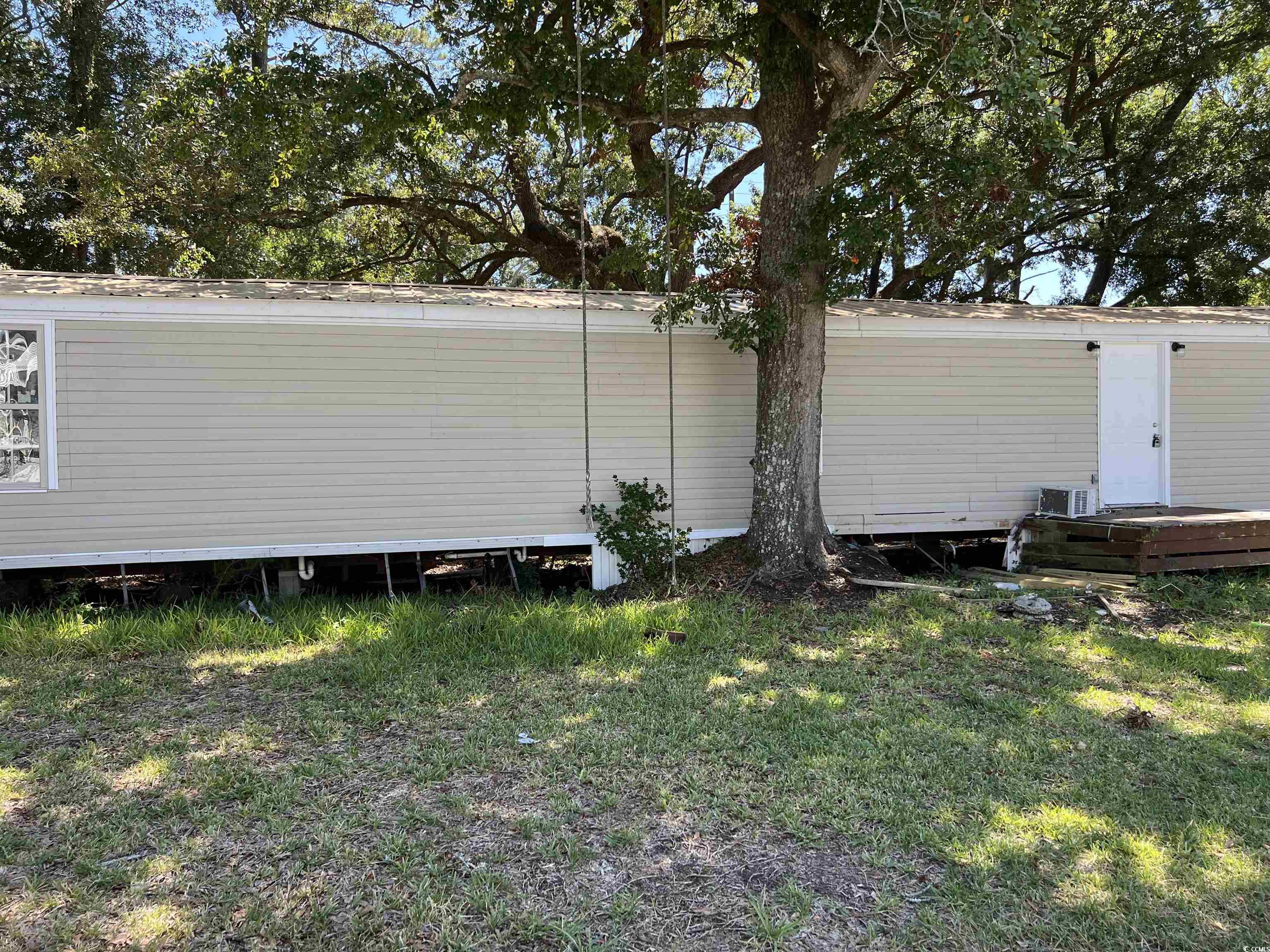 3885 Murrells Inlet Road Murrells Inlet, SC 29576 - Photo 2 of 16 Rear view of property with a lawn