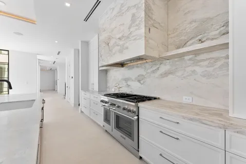 a view of an empty room with a fireplace