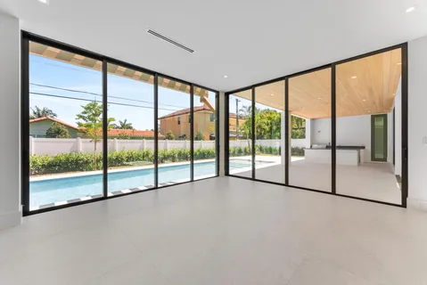 a white bath tub sitting in a bathroom next to a window