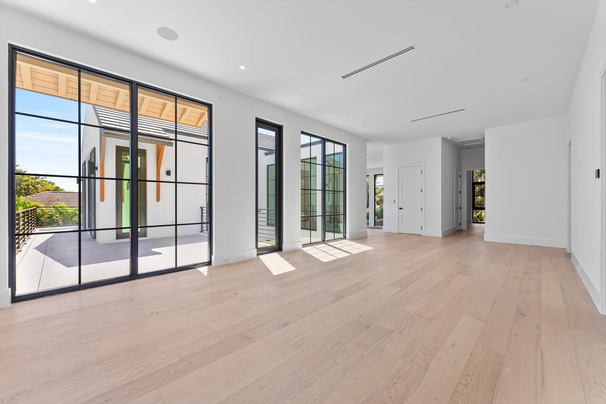 880 Northeast 3rd Avenue Boca Raton, FL 33432 - Photo 58 of 100 an empty room with sliding door and mountain view