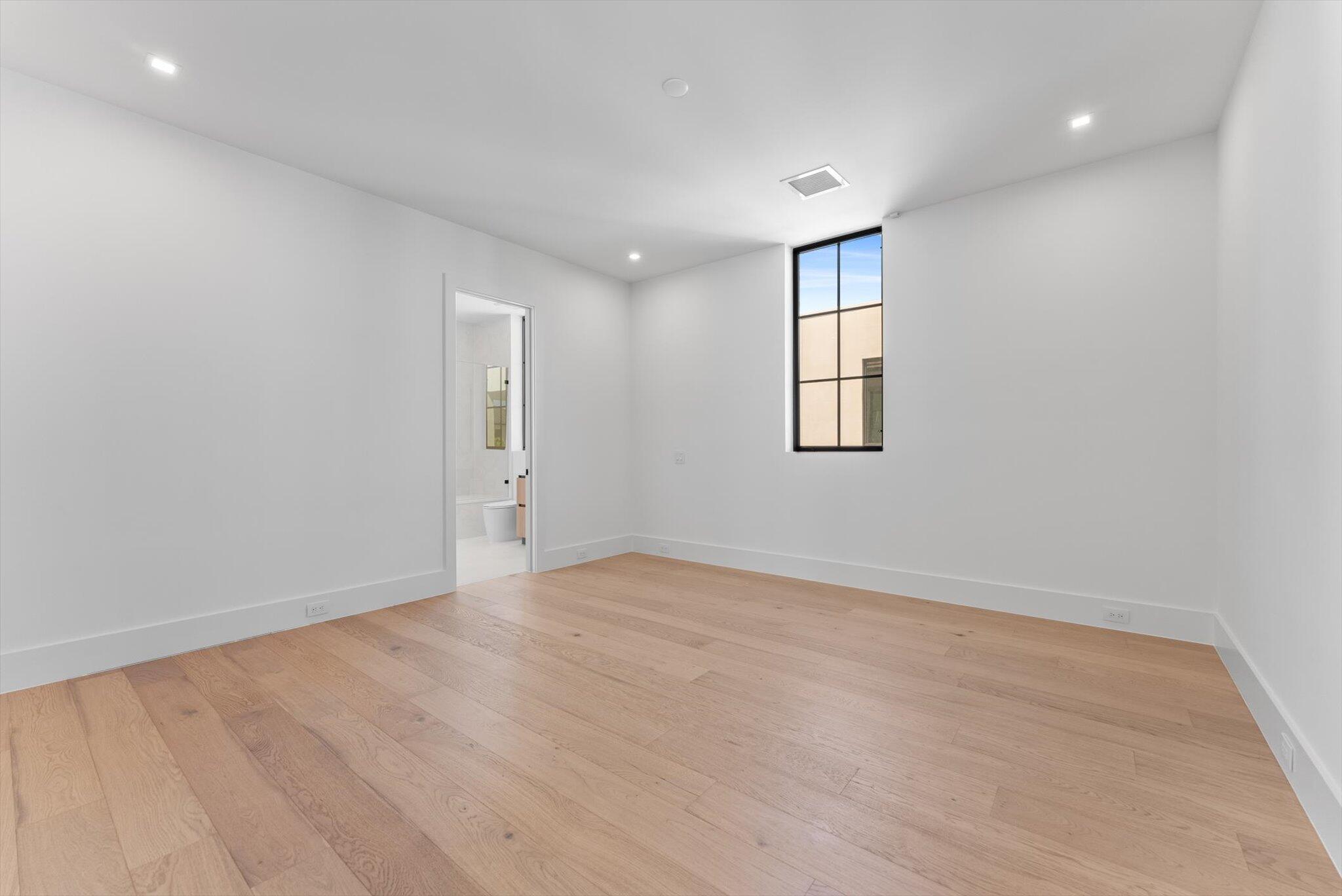 880 Northeast 3rd Avenue Boca Raton, FL 33432 - Photo 66 of 100 an empty room with windows and closet