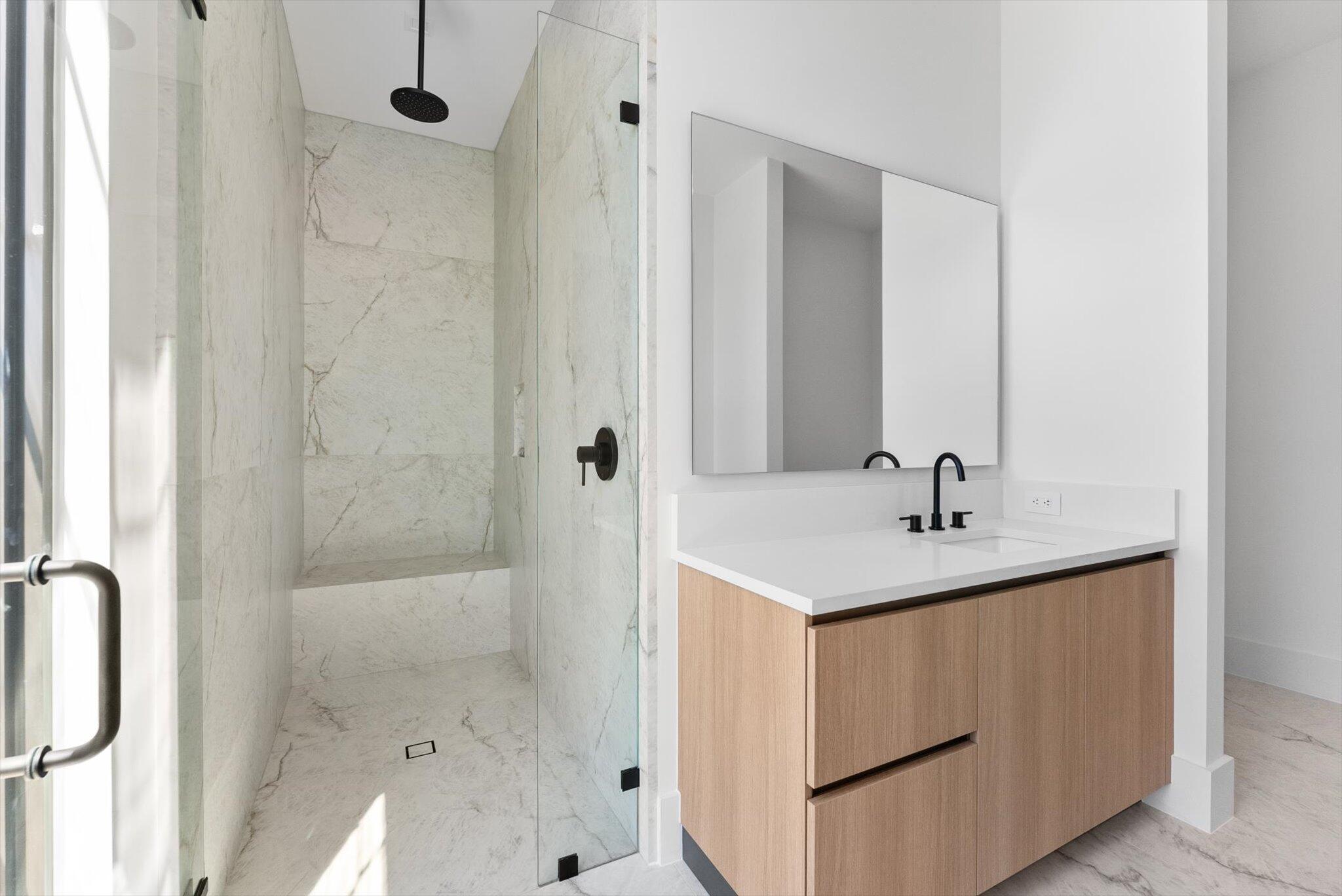 880 Northeast 3rd Avenue Boca Raton, FL 33432 - Photo 72 of 100 a bathroom with a sink and a mirror