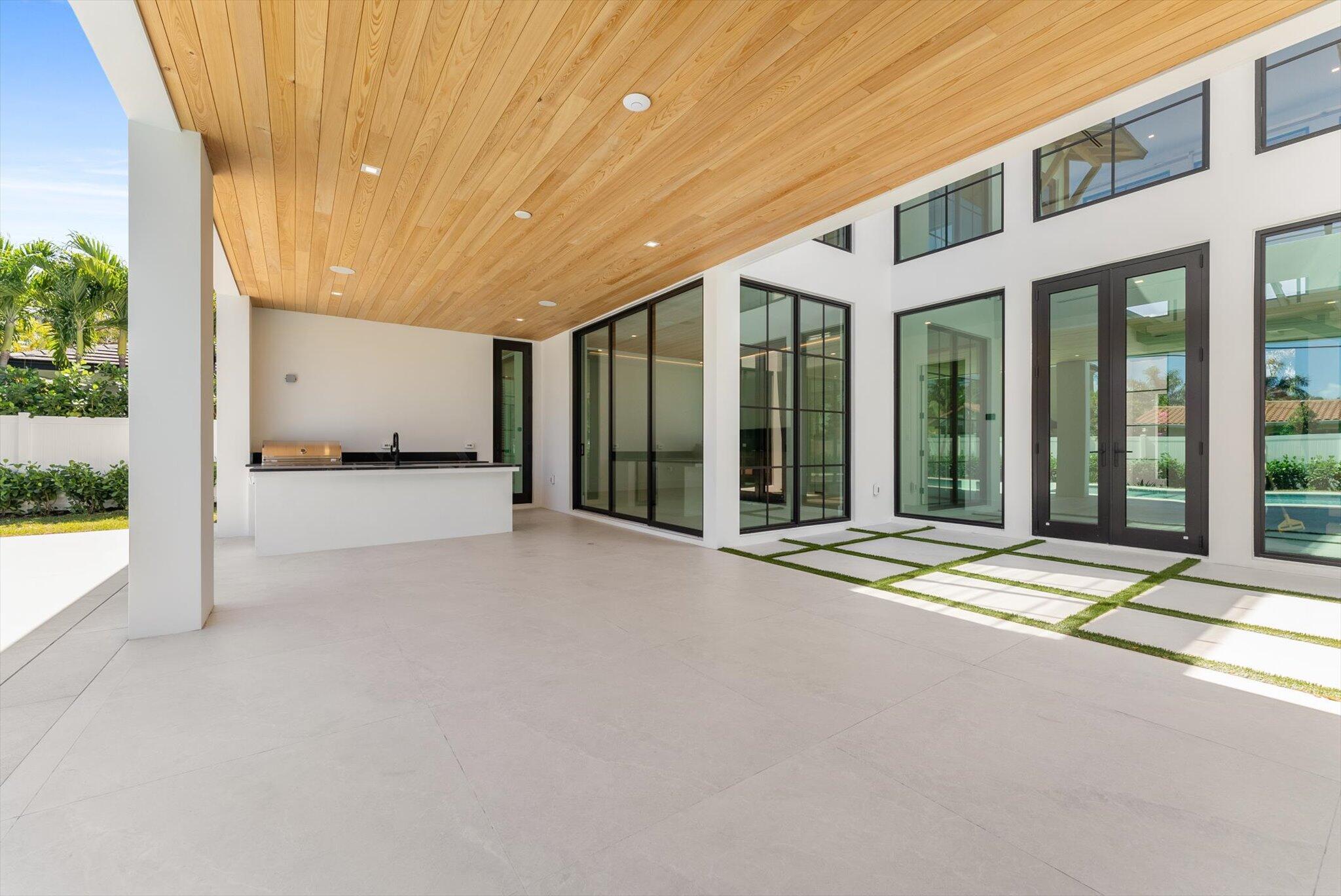 880 Northeast 3rd Avenue Boca Raton, FL 33432 - Photo 77 of 100 a view of a building with a porch