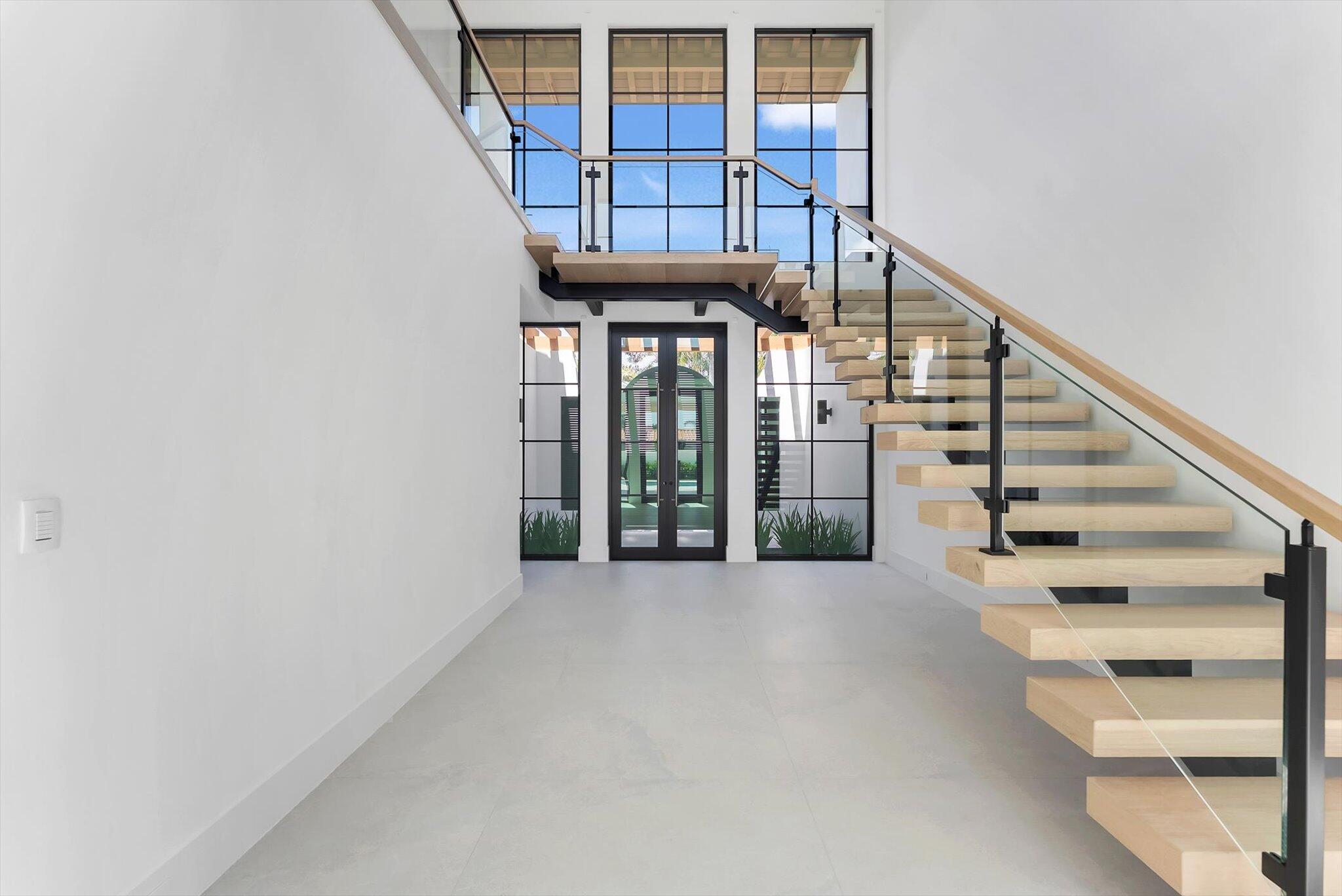 880 Northeast 3rd Avenue Boca Raton, FL 33432 - Photo 8 of 100 a view of staircase with white walls and windows