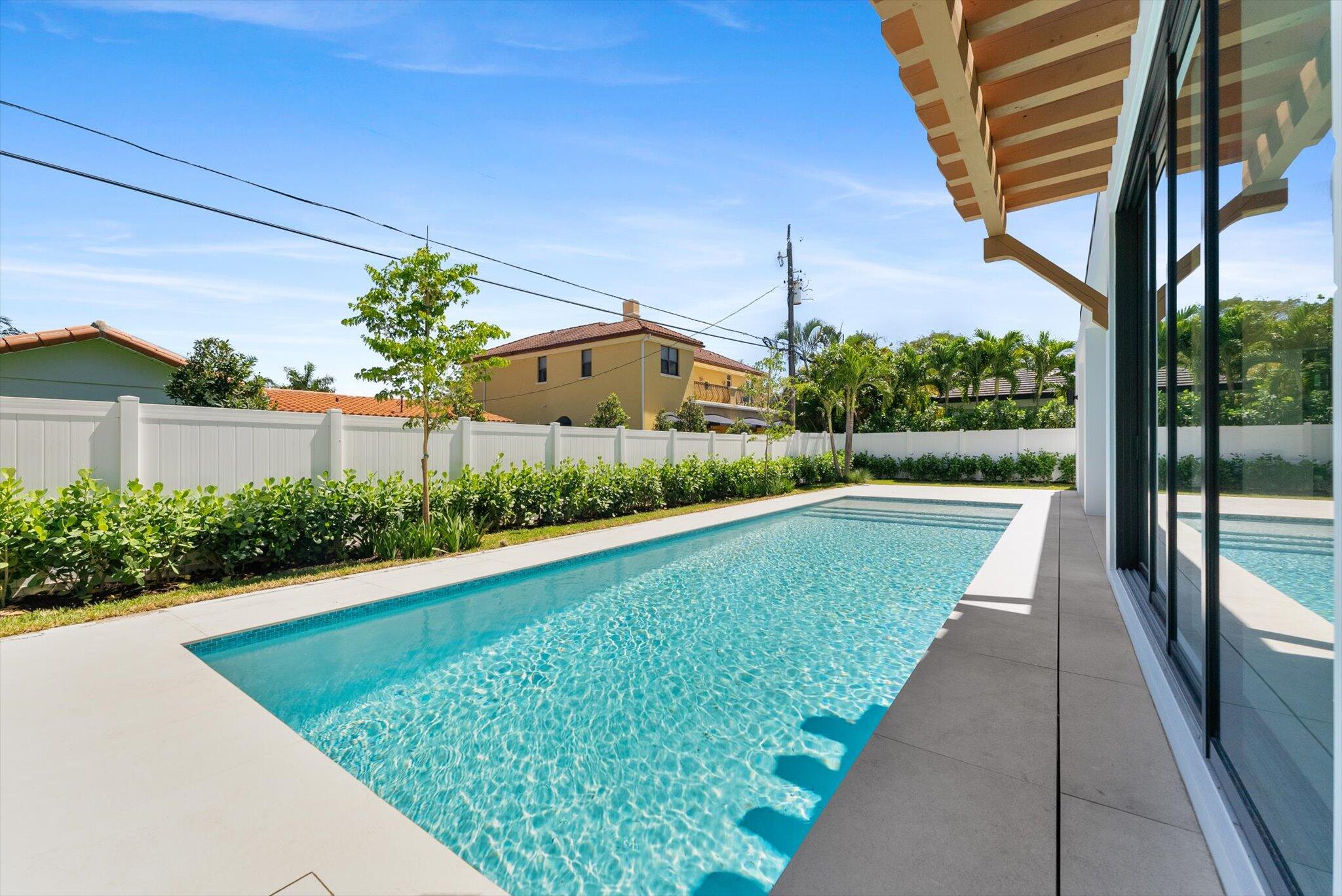 880 Northeast 3rd Avenue Boca Raton, FL 33432 - Photo 86 of 100 a view of swimming pool with a yard