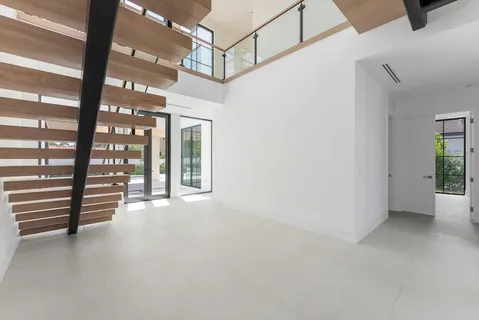 a view of an empty room with a large window