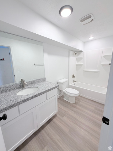 227 South West Lane Provo, UT 84601 - Photo 19 of 25 Contemporary bathroom featuring a white vanity with a speckled countertop, a undermount sink, and a chrome faucet