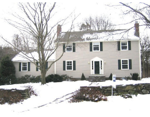 145 Stratford Road Needham, MA 02492 - Photo 1 of 6 a front view of a house with a yard covered in snow