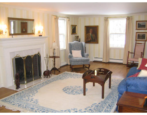 145 Stratford Road Needham, MA 02492 - Photo 4 of 6 a living room with furniture and a fireplace