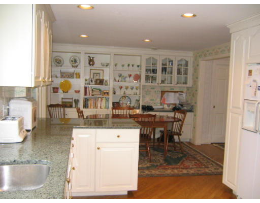 145 Stratford Road Needham, MA 02492 - Photo 6 of 6 a living room with granite countertop furniture and a dining table
