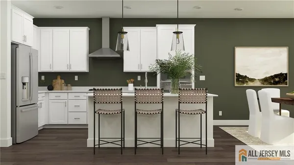 a kitchen with cabinets and wooden floor