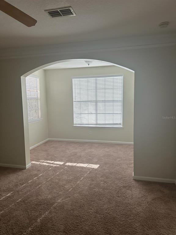 12861 Madison Pointe Circle, Unit 207 Orlando, FL 32821 - Photo 7 of 13 an empty room with windows
