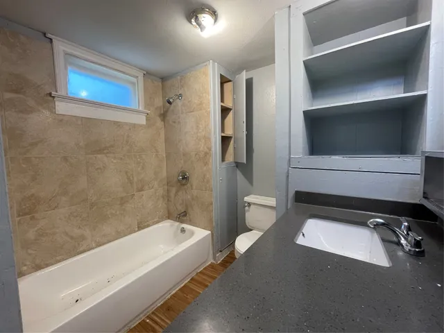 a bathroom with a tub and a vanity