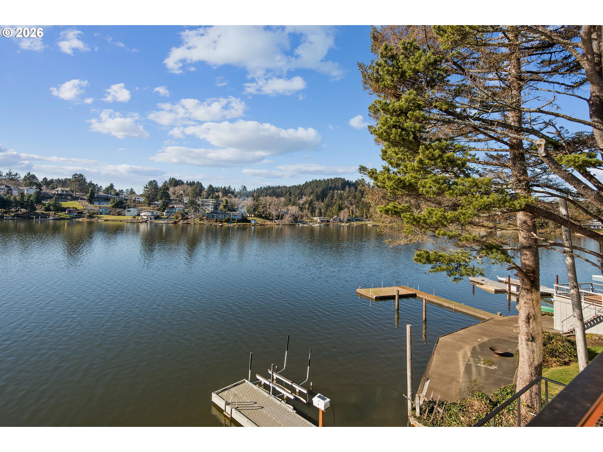 3403 Northeast Johns Loop Neotsu, OR 97364 - Photo 25 of 48 a view of a lake with houses