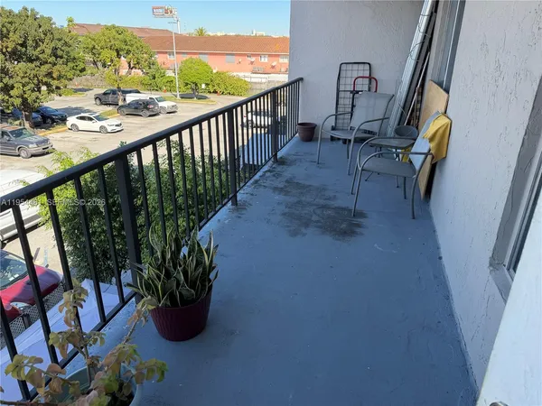 a view of balcony with furniture