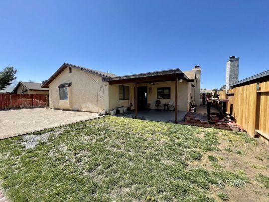 118 Chambers Street Ridgecrest, CA 93555 - Photo 15 of 16 a view of a house with back yard