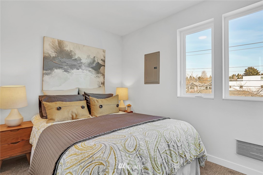 6249 8th Avenue Northwest Seattle, WA 98107 - Photo 19 of 31 a bedroom with a bed and a painting on the wall