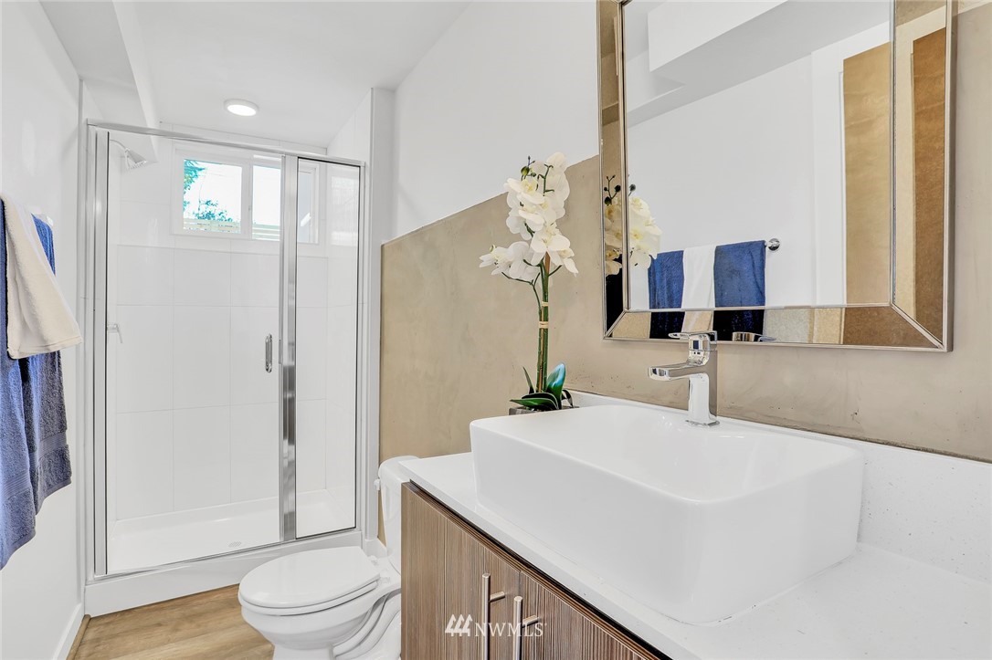 6249 8th Avenue Northwest Seattle, WA 98107 - Photo 21 of 31 a bathroom with a sink a toilet and shower