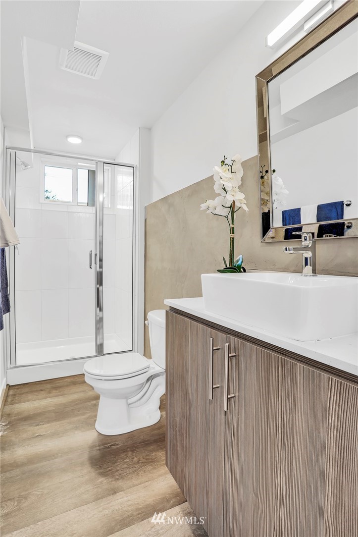 6249 8th Avenue Northwest Seattle, WA 98107 - Photo 22 of 31 a bathroom with a sink and a mirror