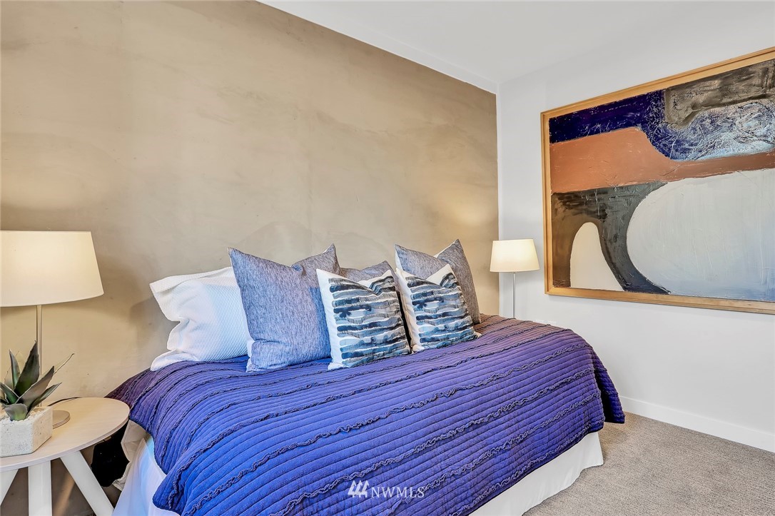 6249 8th Avenue Northwest Seattle, WA 98107 - Photo 24 of 31 a bedroom with a bed and painting on the wall