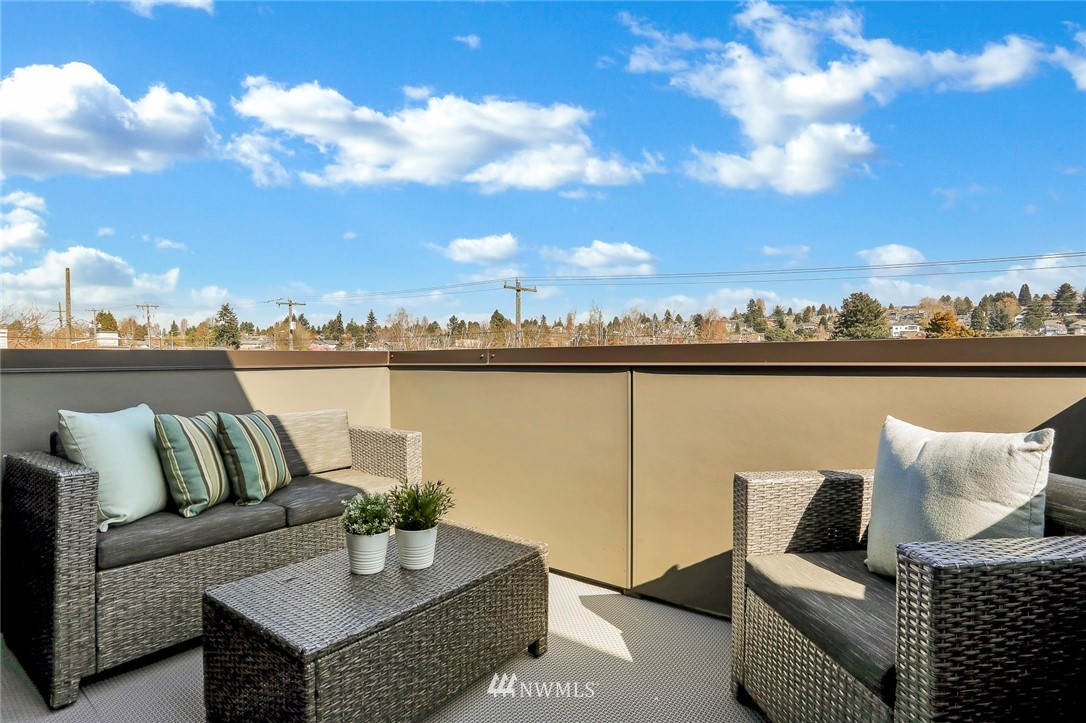 6249 8th Avenue Northwest Seattle, WA 98107 - Photo 25 of 31 a roof deck with couches and sky view