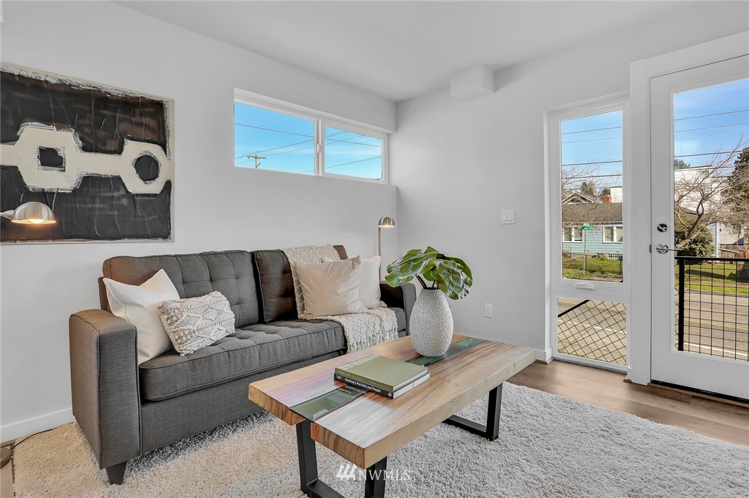 6249 8th Avenue Northwest Seattle, WA 98107 - Photo 6 of 31 a living room with furniture and flowers