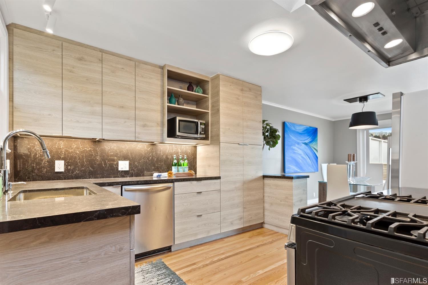 26 Eagle Street San Francisco, CA 94114 - Photo 11 of 56 a kitchen with stainless steel appliances granite countertop a sink stove and cabinets