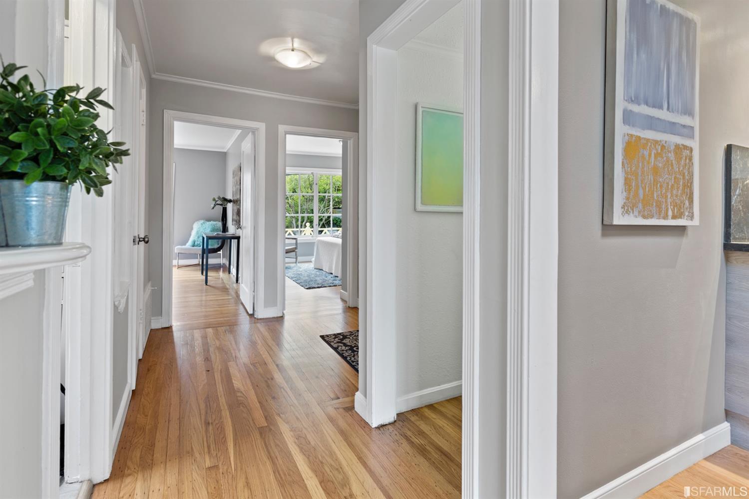 26 Eagle Street San Francisco, CA 94114 - Photo 14 of 56 a view of a hallway with wooden floor and a potted plant