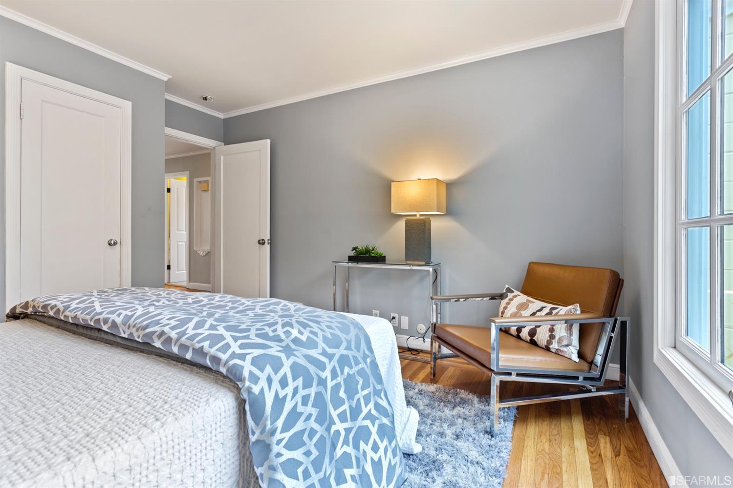 26 Eagle Street San Francisco, CA 94114 - Photo 20 of 56 a bedroom with a bed and wooden floor