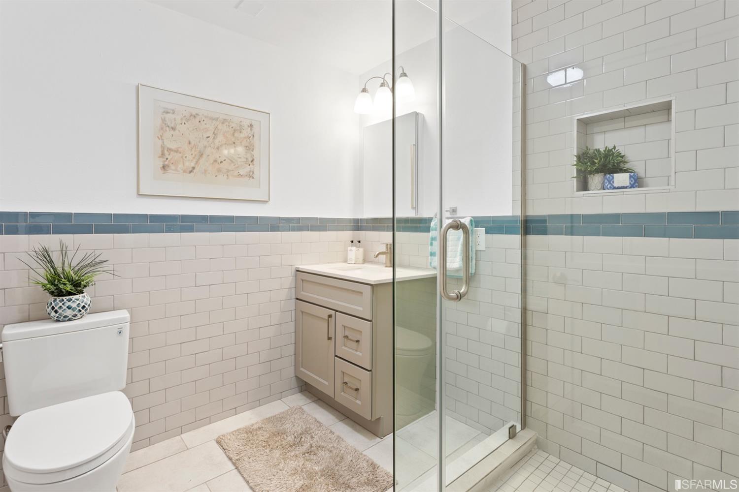 26 Eagle Street San Francisco, CA 94114 - Photo 40 of 56 a bathroom with a granite countertop sink a toilet and shower