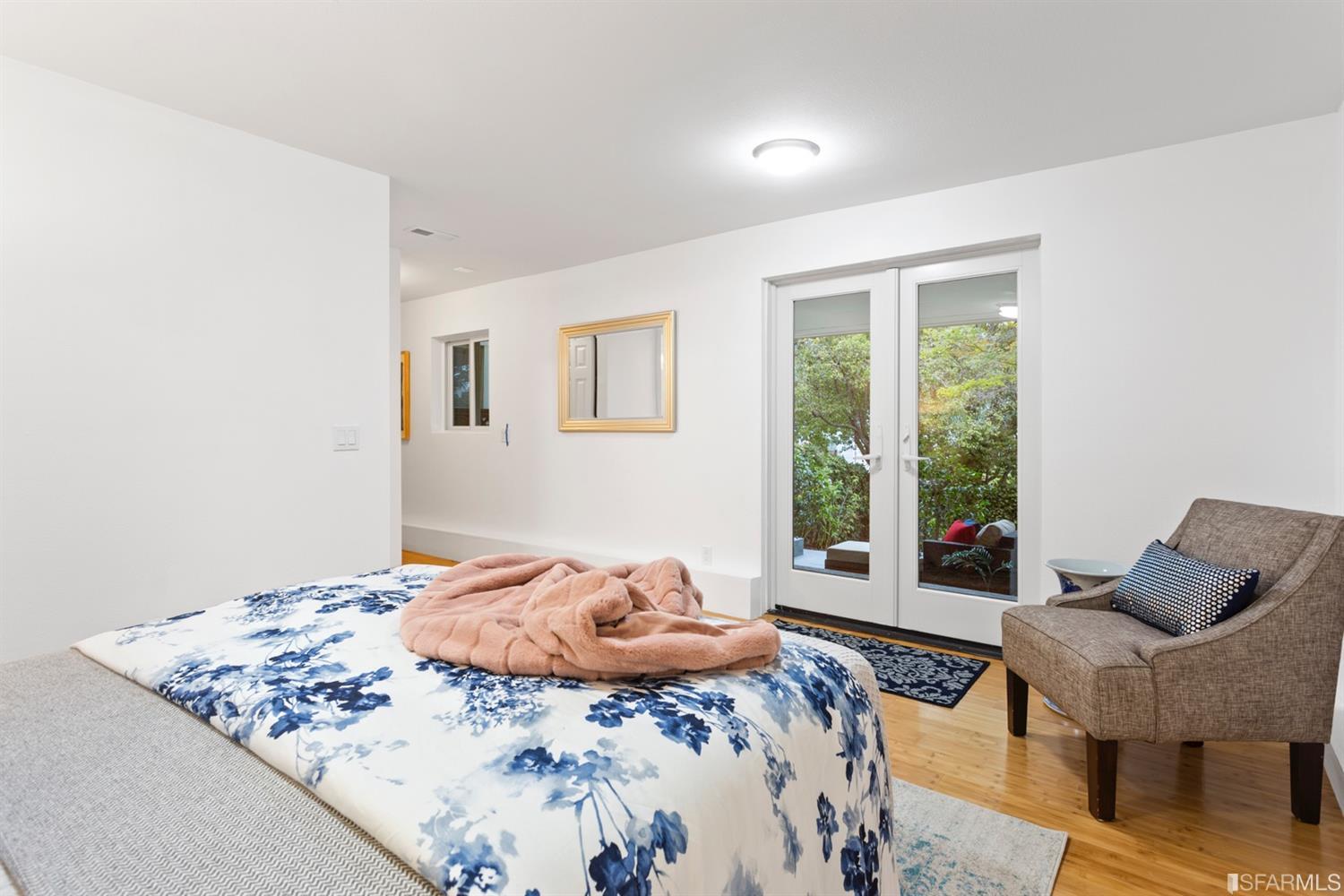 26 Eagle Street San Francisco, CA 94114 - Photo 42 of 56 a bedroom with a bed and wooden floor