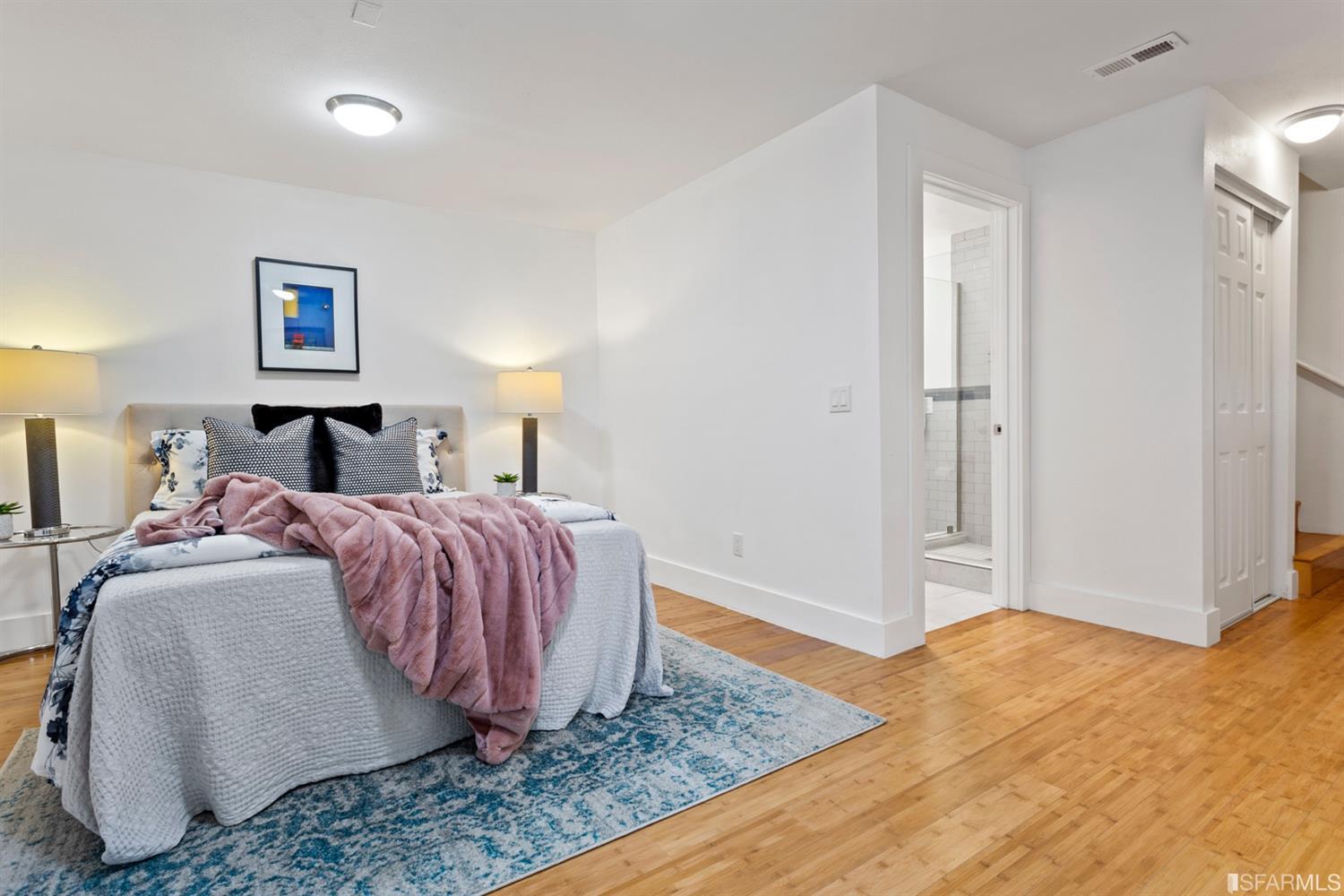 26 Eagle Street San Francisco, CA 94114 - Photo 43 of 56 a bedroom with a bed and wooden floor