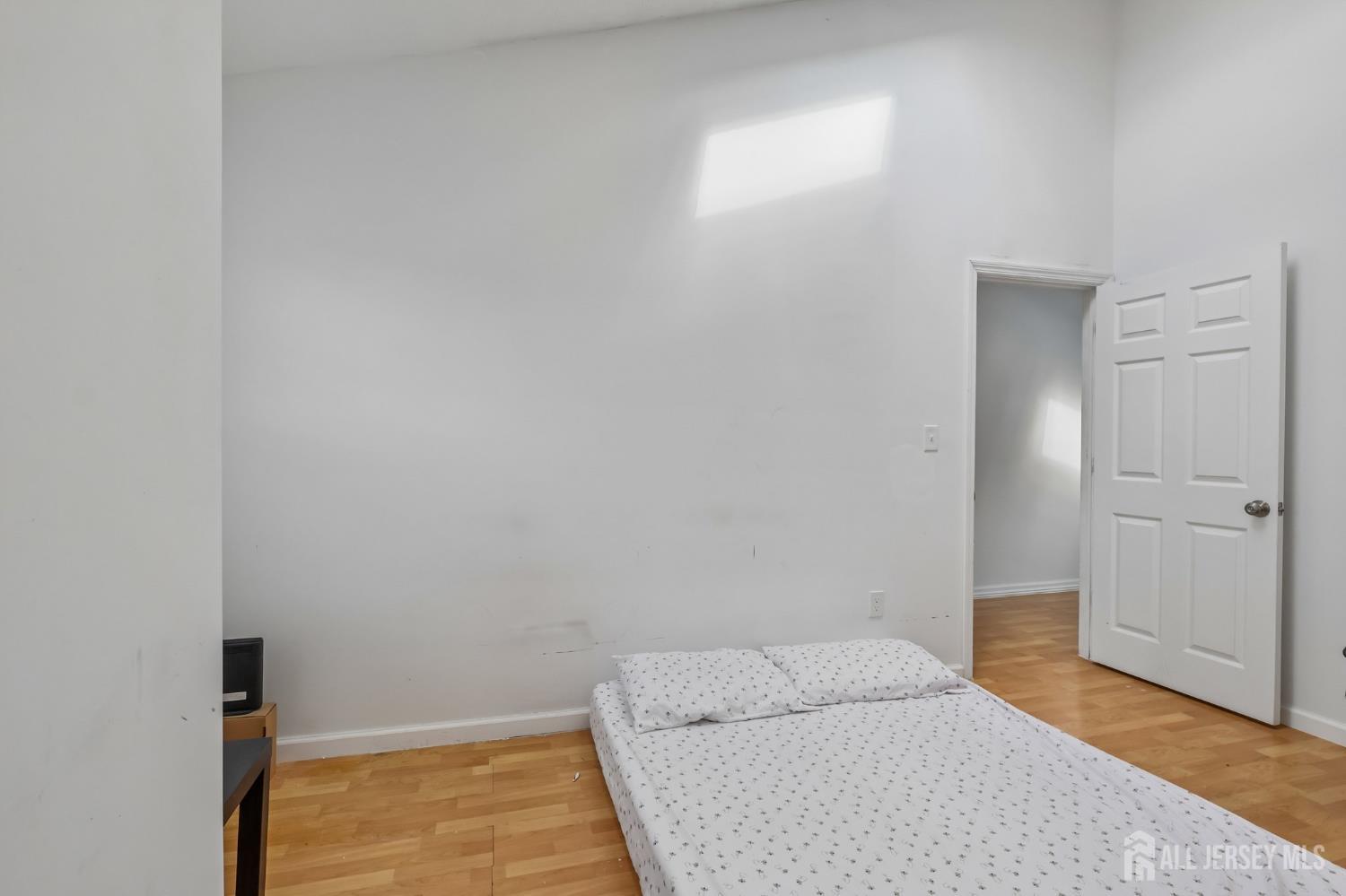 36 Henry Street Edison, NJ 08820 - Photo 15 of 42 a bedroom with a bed and a window