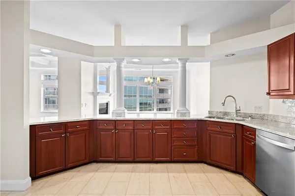 a large kitchen with a sink and window