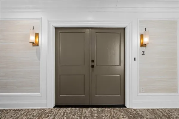 a view of a bathroom with a glass door