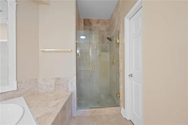 a bathroom with a shower and a sink