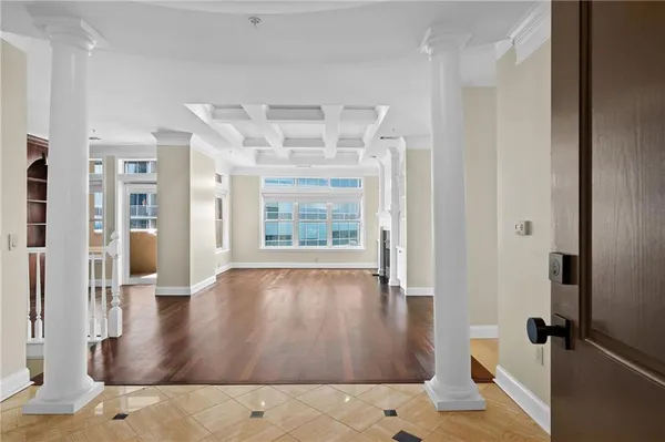 wooden floor in a empty room with a window