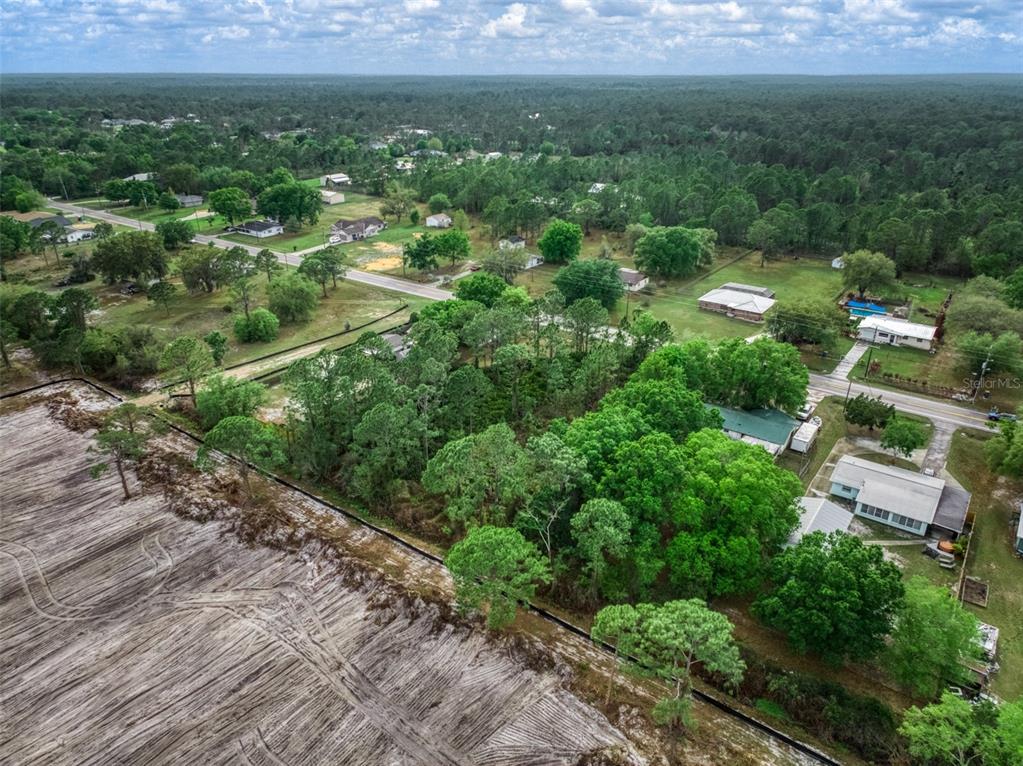4814 Lakewood Road Sebring, FL 33875 - Photo 11 of 17 a view of a city with lush green forest