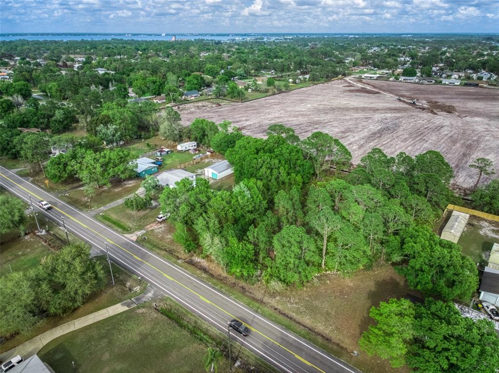 4814 Lakewood Road Sebring, FL 33875 - Photo 14 of 17 a view of a garden with a bench and yard
