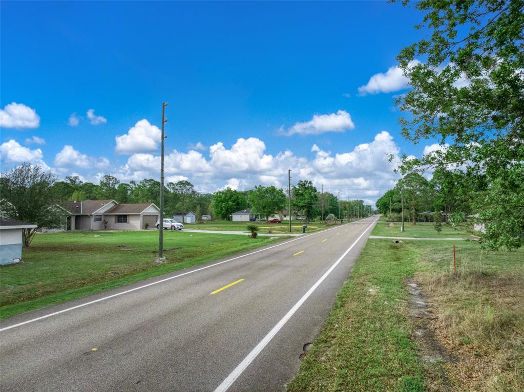 4814 Lakewood Road Sebring, FL 33875 - Photo 7 of 17 a view of a yard and entertaining space