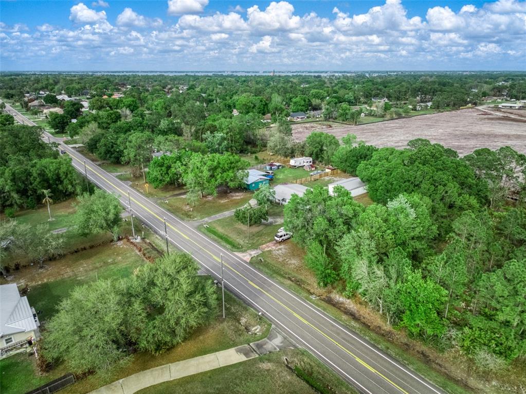 4814 Lakewood Road Sebring, FL 33875 - Photo 8 of 17 a view of a yard with potted plants
