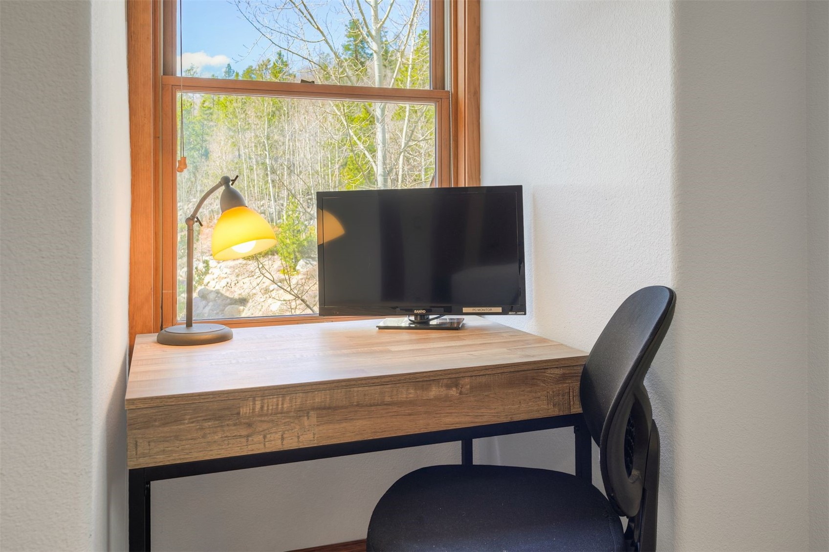 71 Antlers Gulch Road, Unit 303 Keystone, CO 80435 - Photo 24 of 35 a view of a window with chair and table