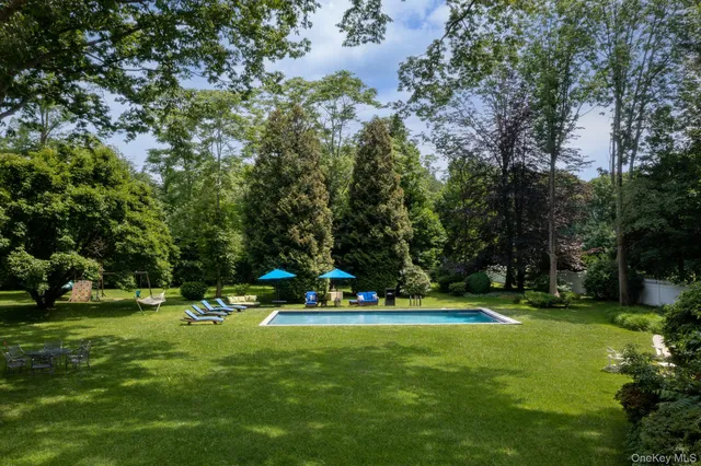 a view of a table and chairs in the garden