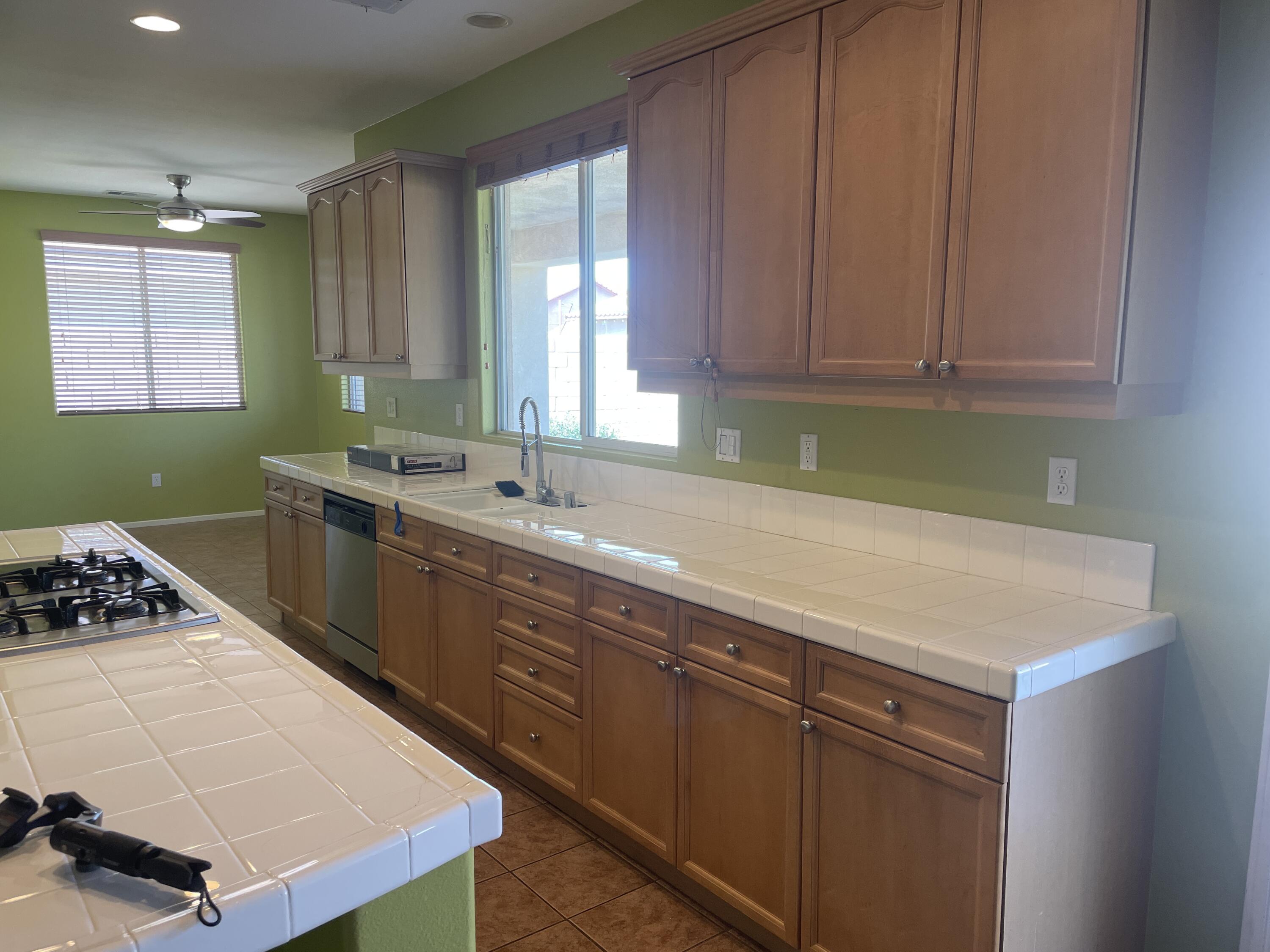 82838 Vincent Drive Indio, CA 92203 - Photo 12 of 37 a kitchen with a sink cabinets and window